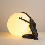 Humanoid Ball Holding Table Lamp
