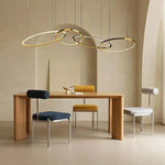 Modern Minimalist Round Dining Table with Gold Chandeliers