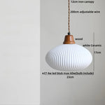 Afralia™ White Ceramic Tassel LED Pendant Lamp - Modern Nordic Wood Hand-drawn Fixture for Bedroom and Cafe