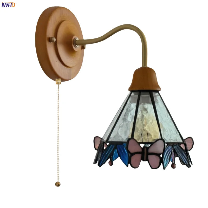 Butterfly Glass LED Wall Light with Copper Arm for Home Decor.