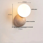 White Glass Globe LED Wall Light on Yellow Stone Base