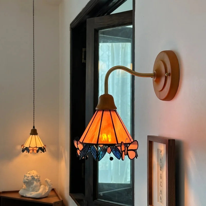 Butterfly Glass LED Wall Light with Copper Arm for Home Decor.