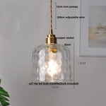 Minimalist Clear Glass Pendant Light Fixture with Copper Socket for Modern Living Space