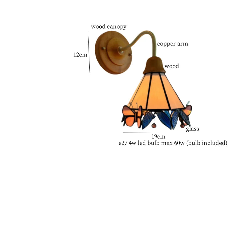 Butterfly Glass LED Wall Light with Copper Arm for Home Decor.