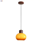 Afralia™ Amber Glass LED Pendant Light for Kitchen Cafe Restaurant Rustic Wood Interior Lighting