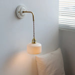 Afralia™ Copper Ceramic LED Wall Light with Pull Chain Switch for Living Room Decor.