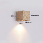 White Glass Globe LED Wall Light on Yellow Stone Base