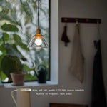 Minimalist Clear Glass Pendant Light Fixture with Copper Socket for Modern Living Space