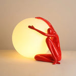 Humanoid Ball Holding Table Lamp