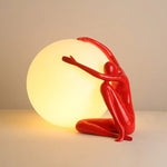 Humanoid Ball Holding Table Lamp