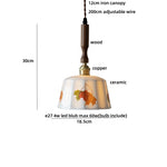 Afralia™ White Ceramic Tassel LED Pendant Lamp - Modern Nordic Wood Hand-drawn Fixture for Bedroom and Cafe