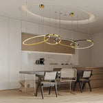 Modern Minimalist Round Dining Table with Gold Chandeliers