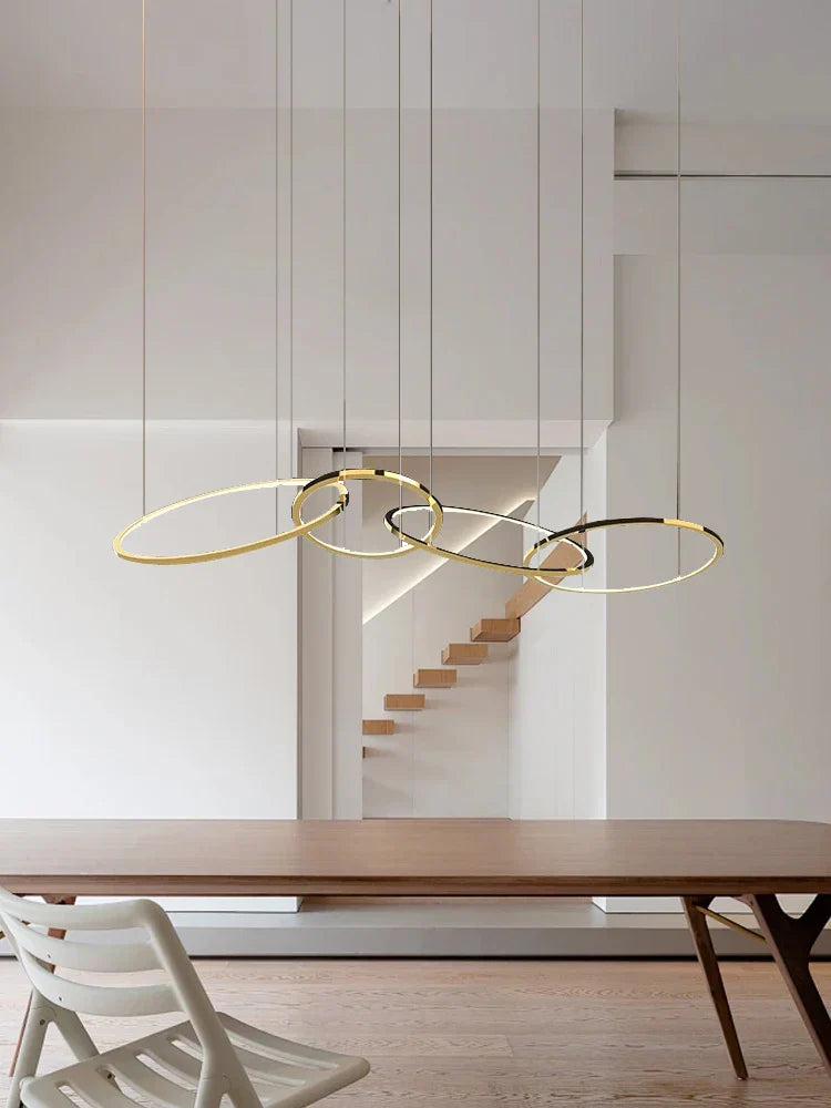 Modern Minimalist Round Dining Table with Gold Chandeliers